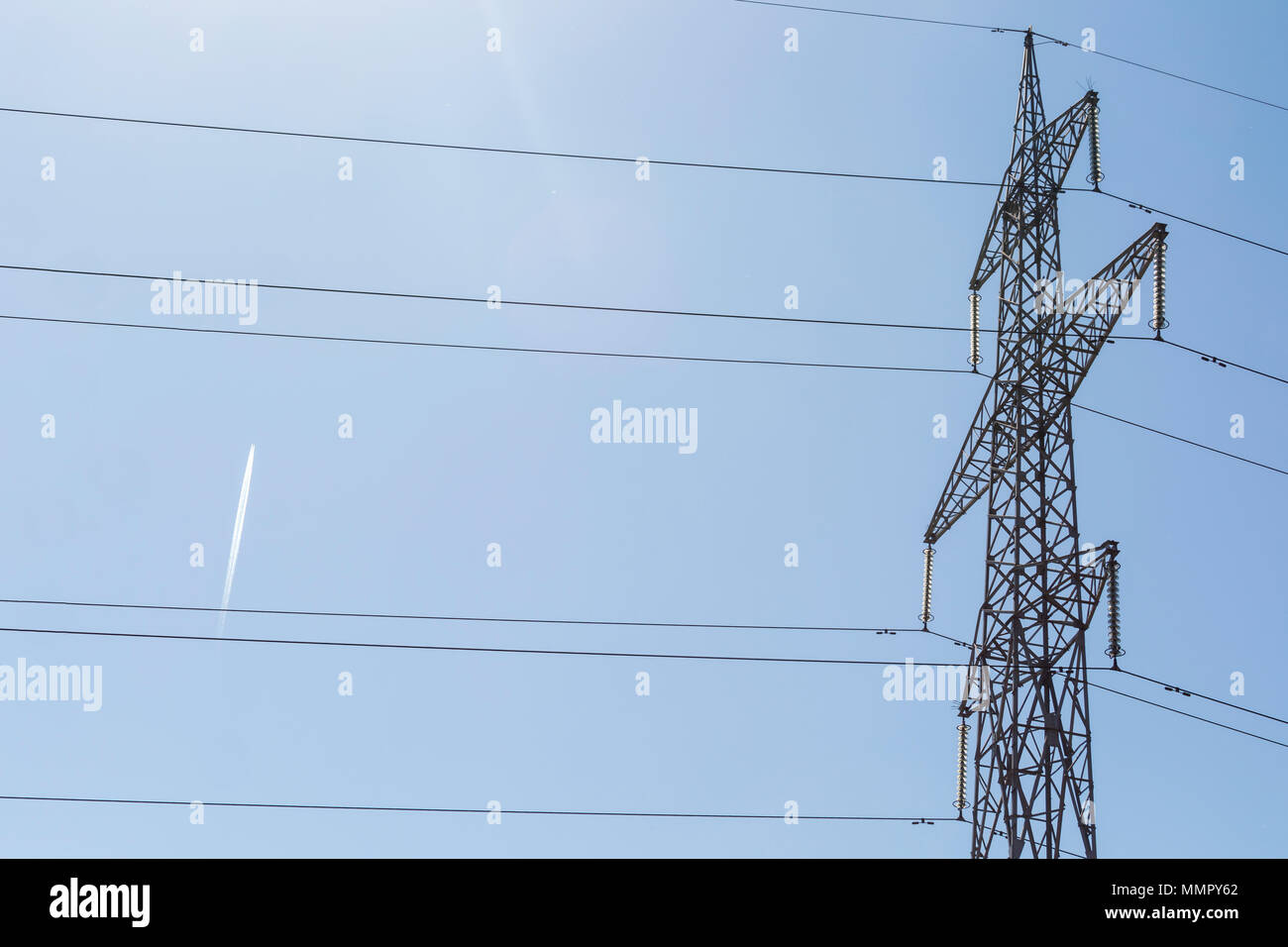 Electricity pillar high voltage line, blue sky background Stock Photo ...