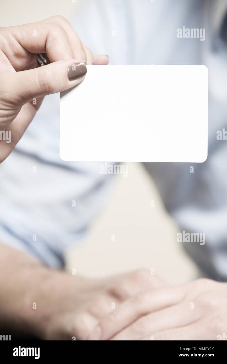 white blank card, a hand is holding it, space for text, business style Stock Photo