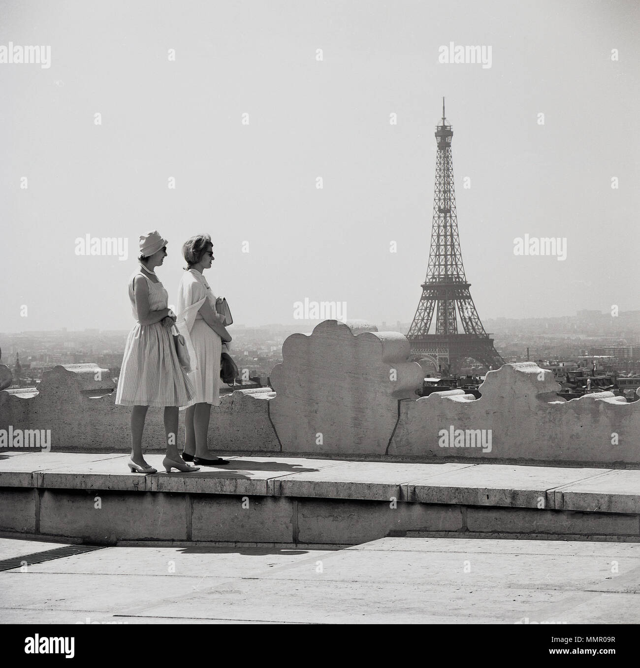 1950s, historical picture by J Allan Cash showing two elegant well