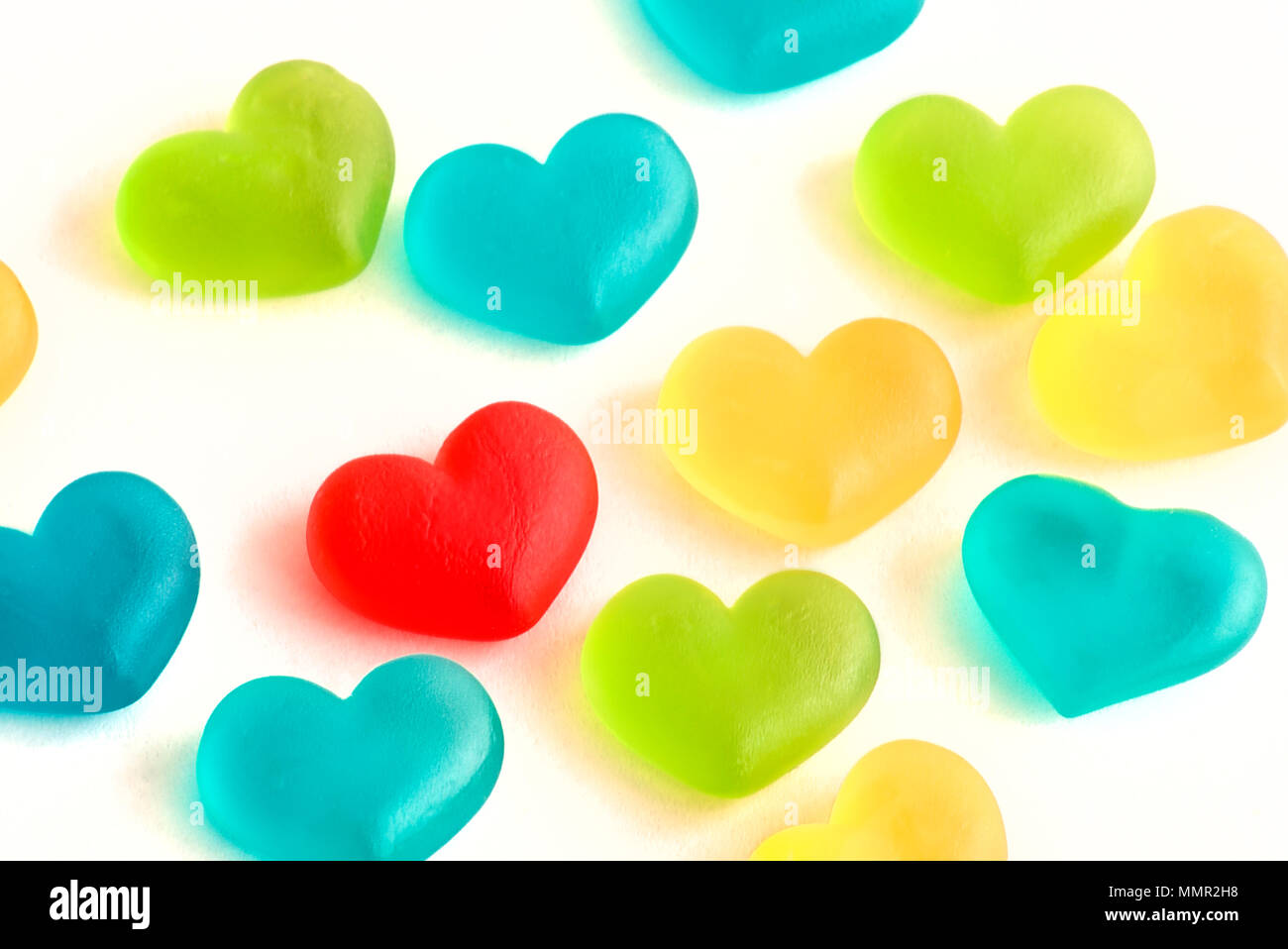 Picture of Gummy Sweet Hearts of many colors, one of this red is more
