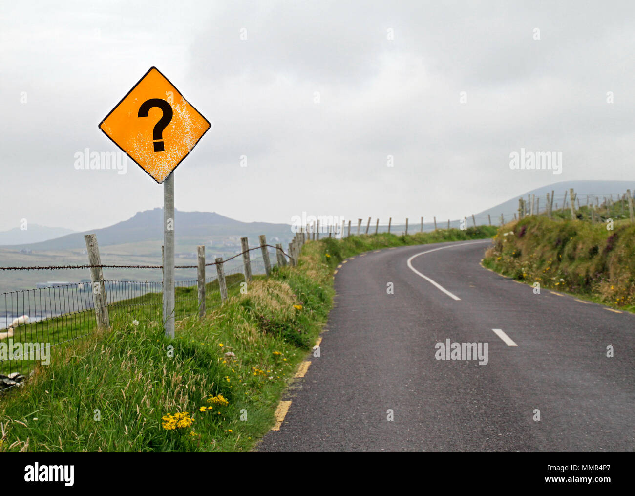 Yellow road sign with question mark Stock Photo