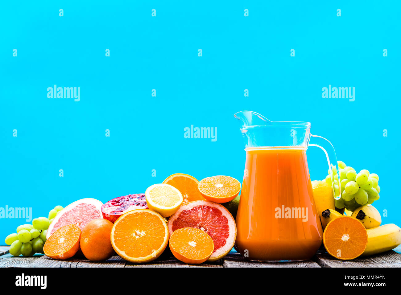 Tropical juice with fruits, fresh squeezed refreshing summer drink in