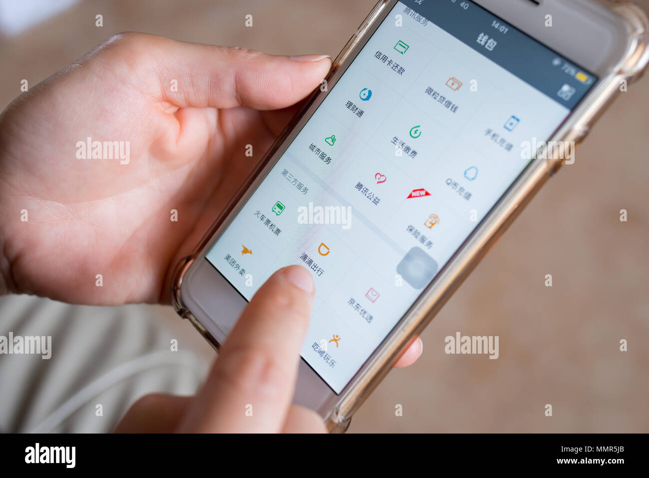 Zhongshan,China-April 8, 2018:lady about to use the Didi ChuXing on Wechat,it's the no.1 car calling app in China. Stock Photo