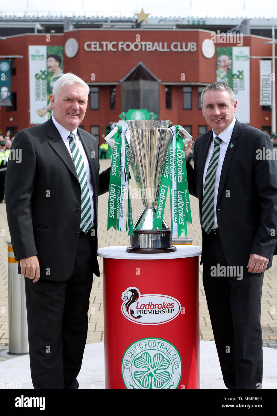 Former Celtic players Roy Aitken (left) and Tom Boyd with the Scottish Premiership trophy before the Ladbrokes Scottish Premiership match at Celtic Park, Glasgow. Stock Photo