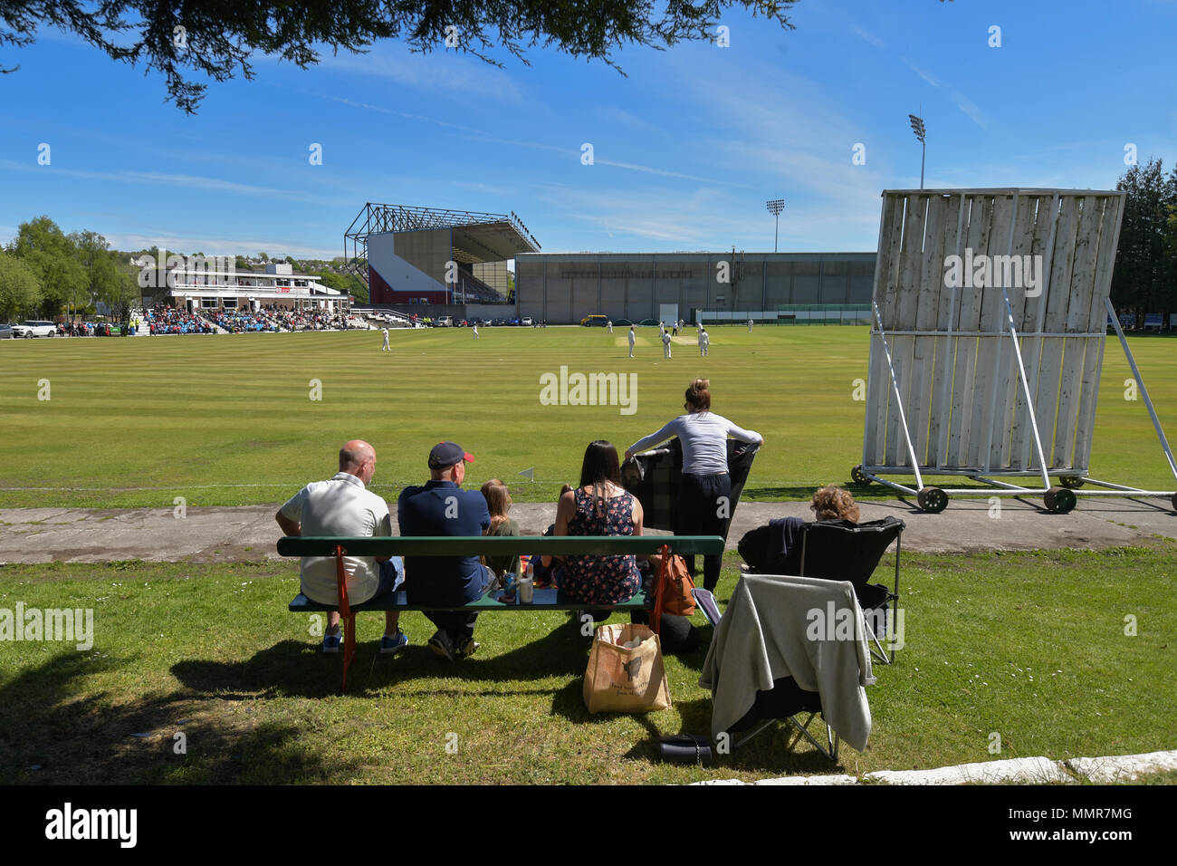 Fans watch a cricket match at Burnley Cricket Club next to Turf Moor prior  to the Premier League match at Turf Moor, Burnley Stock Photo - Alamy