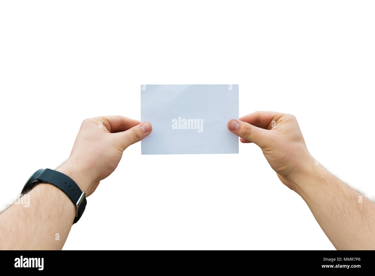 Man hands holding a white paper sheet isolated over white background. Stock Photo