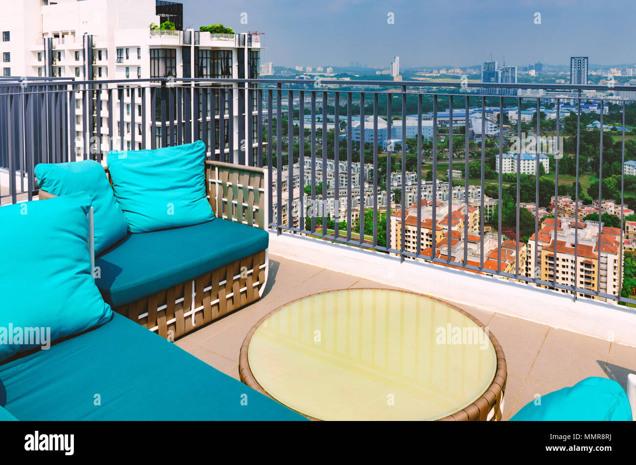 New modern terrace, balcony on roof of high rise building with beautiful  view of cityscape. Picturesque patio with wicker soft sofa for rest.  Malaysia Stock Photo - Alamy