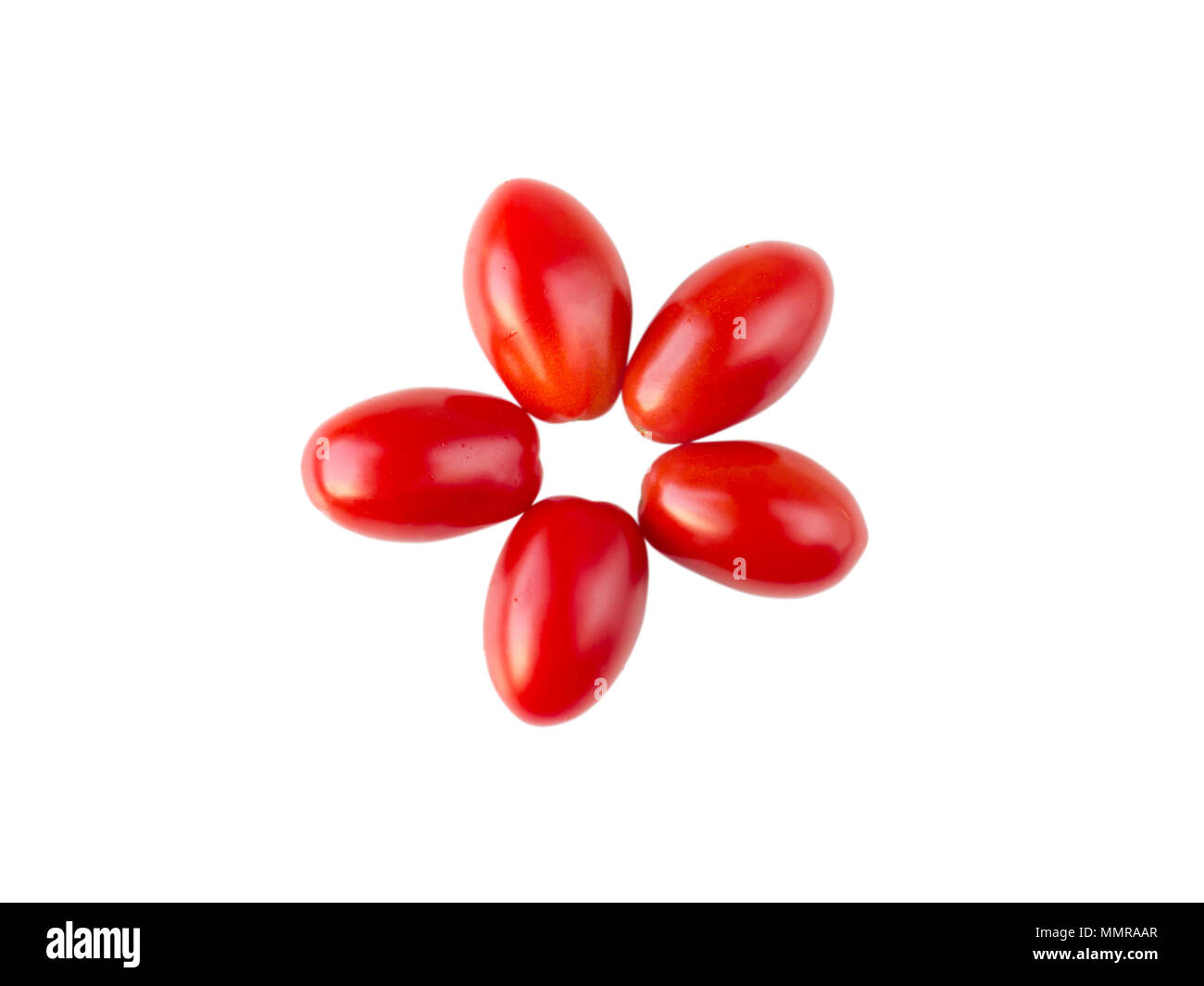 Five pointed star or flower formed by five red plum shaped tomatoes isolated on white flatlay. Vegetable recipe ingredient. Stock Photo
