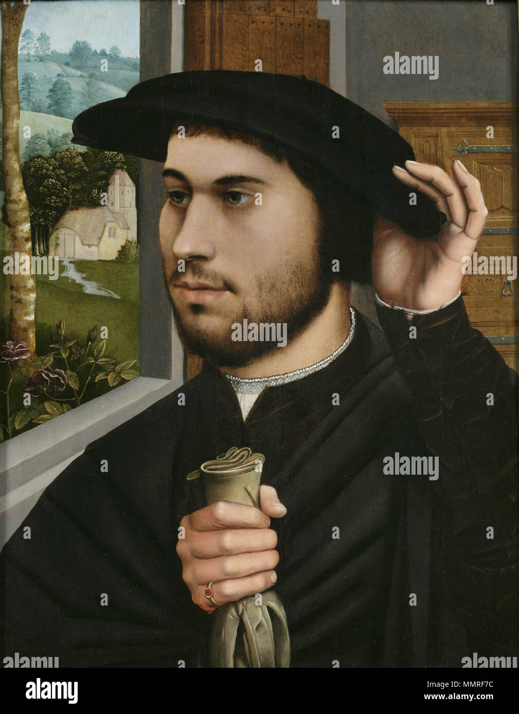 Portrait of a Man at a Window. circa 1530. Ambrosius Benson - Portrait of a Man at a Window 1530 Stock Photo
