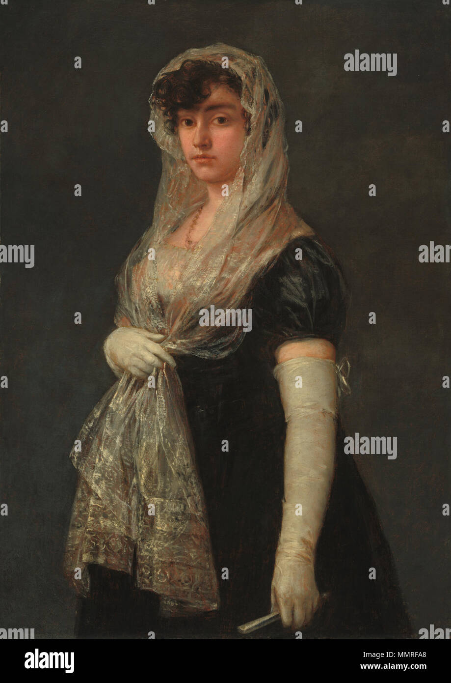 Young Lady Wearing a Mantilla and Basquina Painting; oil on canvas; overall: 109.5 x 77.5 cm (43 1/8 x 30 1/2 in.) framed: 125.4 x 93.6 x 6 cm (49 3/8 x 36 7/8 x 2 3/8 in.); Goya - Joven dama con mantilla y basquiña Stock Photo