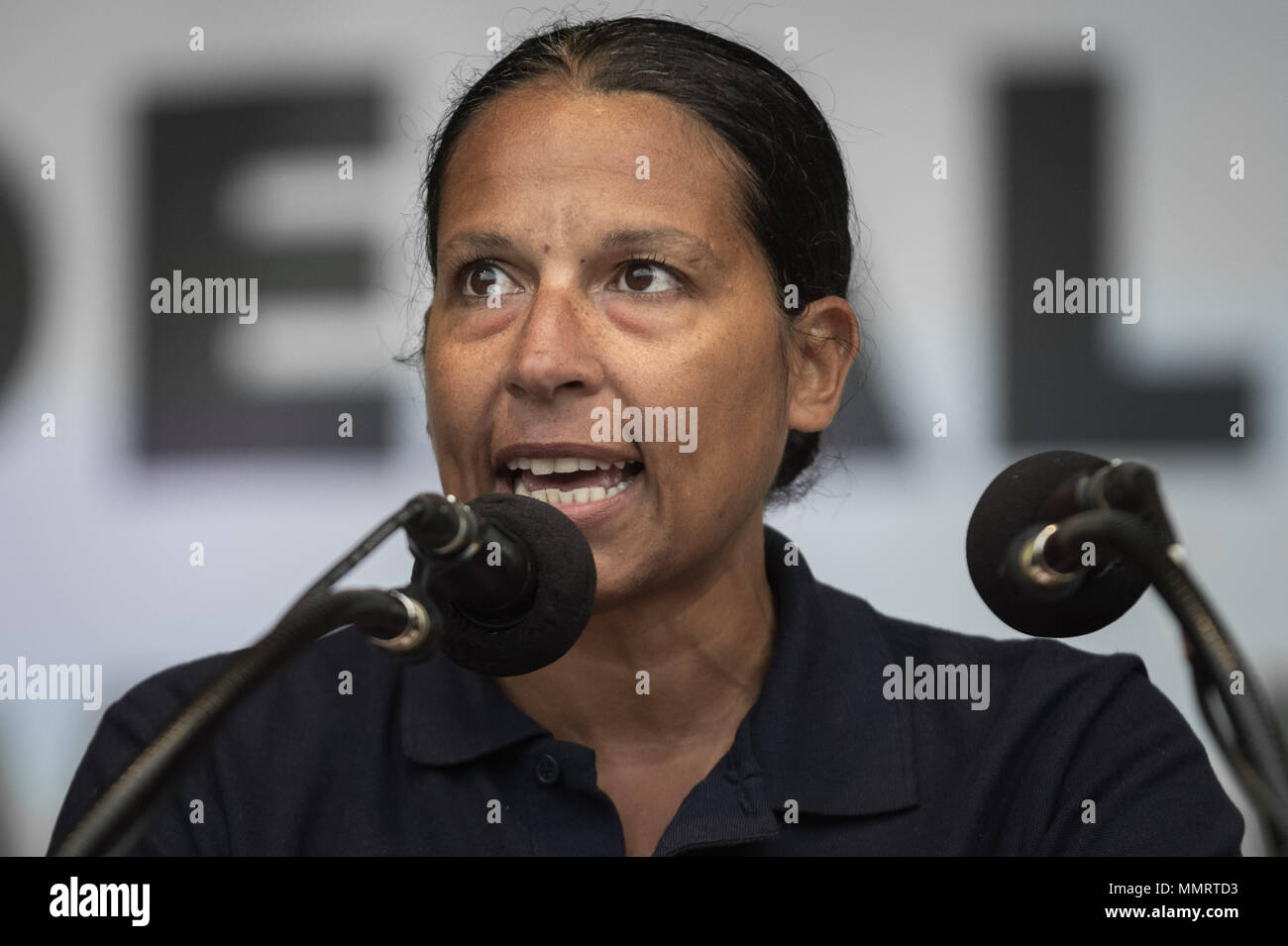 London, UK. 12th May, 2018. Lucy Masoud, The Fire Brigades Union’s London regional official representative, speaks to a crowd of  thousands of trade unionists during a TUC rally in Hyde Park on the theme of ‘a new deal for working people', aimed against government austerity and injustice. Credit: Guy Corbishley/Alamy Live News Stock Photo