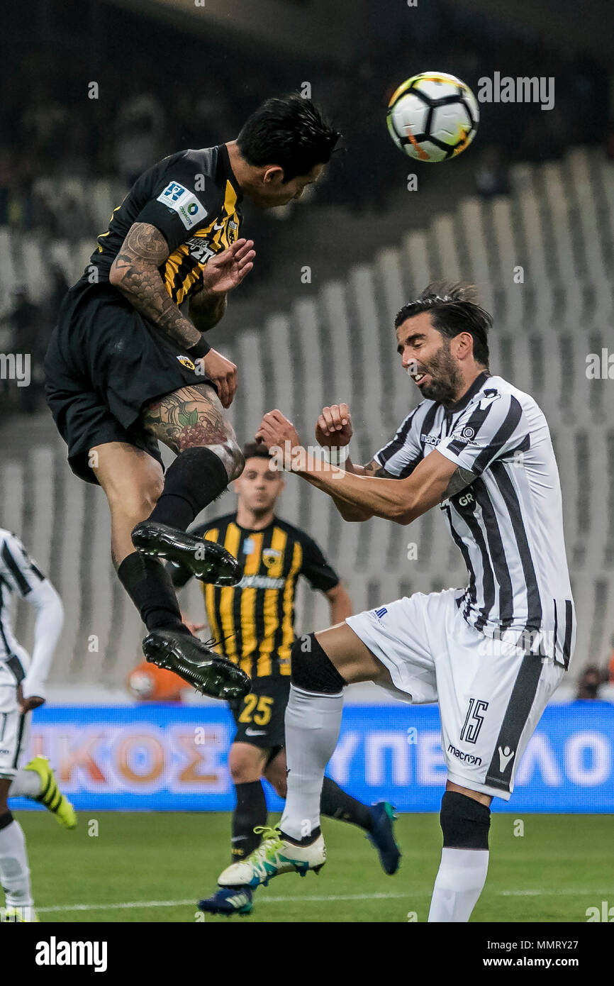 Athens, Greece. 12th May, 2018. PAOK Thessaloniki's Jose Angel Crespo (R)  vies with AEK Athens' Sergio Araujo during the Greek Cup Final soccer match  at the Olympic Stadium in Athens, Greece, on