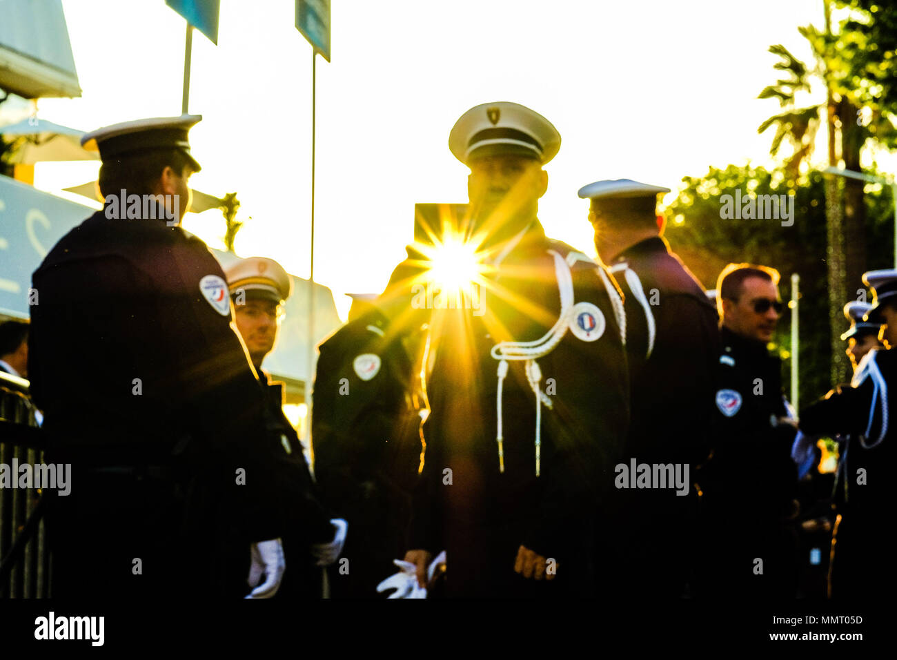 Cannes, France. 12th May 2018. Atmosphere at Palais des Festivals on Saturday 12 May 2018 during the 71st Cannes Film Festival held at Palais des Festivals, Cannes. Pictured: Police officers in the evening light. Picture by Julie Edwards/LFI/Avalon. Credit: Julie Edwards/Alamy Live News Stock Photo