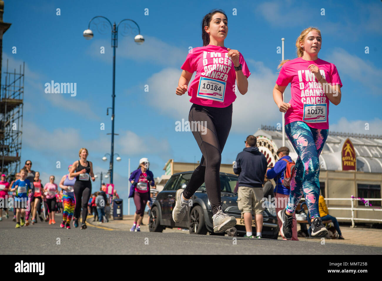 Aberystwyth Wales UK, Sunday 13 May 20918 UK Weather: Over a thousand women and girls, all dressed in shades of pink, with some in fancy dress too, took part in the annual Cancer Research fund-raising ‘Race for Life’ over 5km and 10km courses along Aberystwyth’s promenade, on a bright and sunny May Sunday morning. It is anticipated that once all the sponsorship money has been received, this single event will have raised over £50,000 for cancer research in the UK  photo © Keith Morris / Alamy Live News Stock Photo