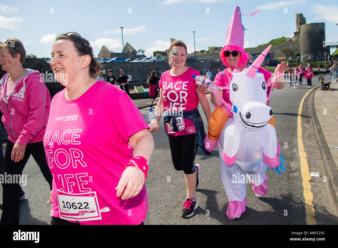 Aberystwyth Wales UK, Sunday 13 May 20918 UK Weather: Over a thousand women and girls, all dressed in shades of pink, with some in fancy dress too, took part in the annual Cancer Research fund-raising ‘Race for Life’ over 5km and 10km courses along Aberystwyth’s promenade, on a bright and sunny May Sunday morning. It is anticipated that once all the sponsorship money has been received, this single event will have raised over £50,000 for cancer research in the UK  photo © Keith Morris / Alamy Live News Stock Photo