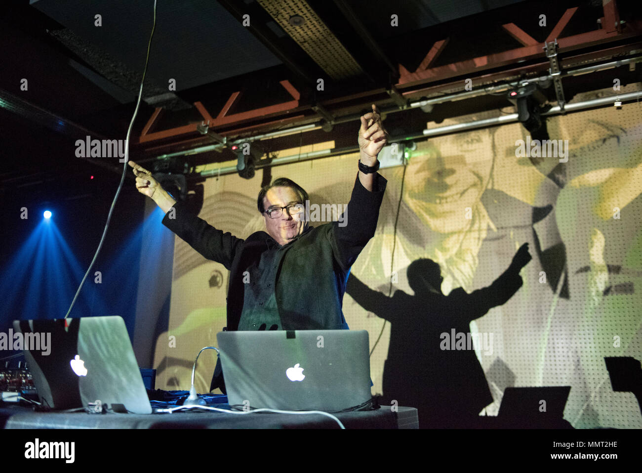 Leeds, UK. 12th May 2018. Wolfgang Flur, former member of German electronic band Kraftwerk performs a set at the Brudenell Social Club, Leeds, UK. In the background are projected images of Kraftwerk members. Credit: John Bentley/Alamy Live News Stock Photo