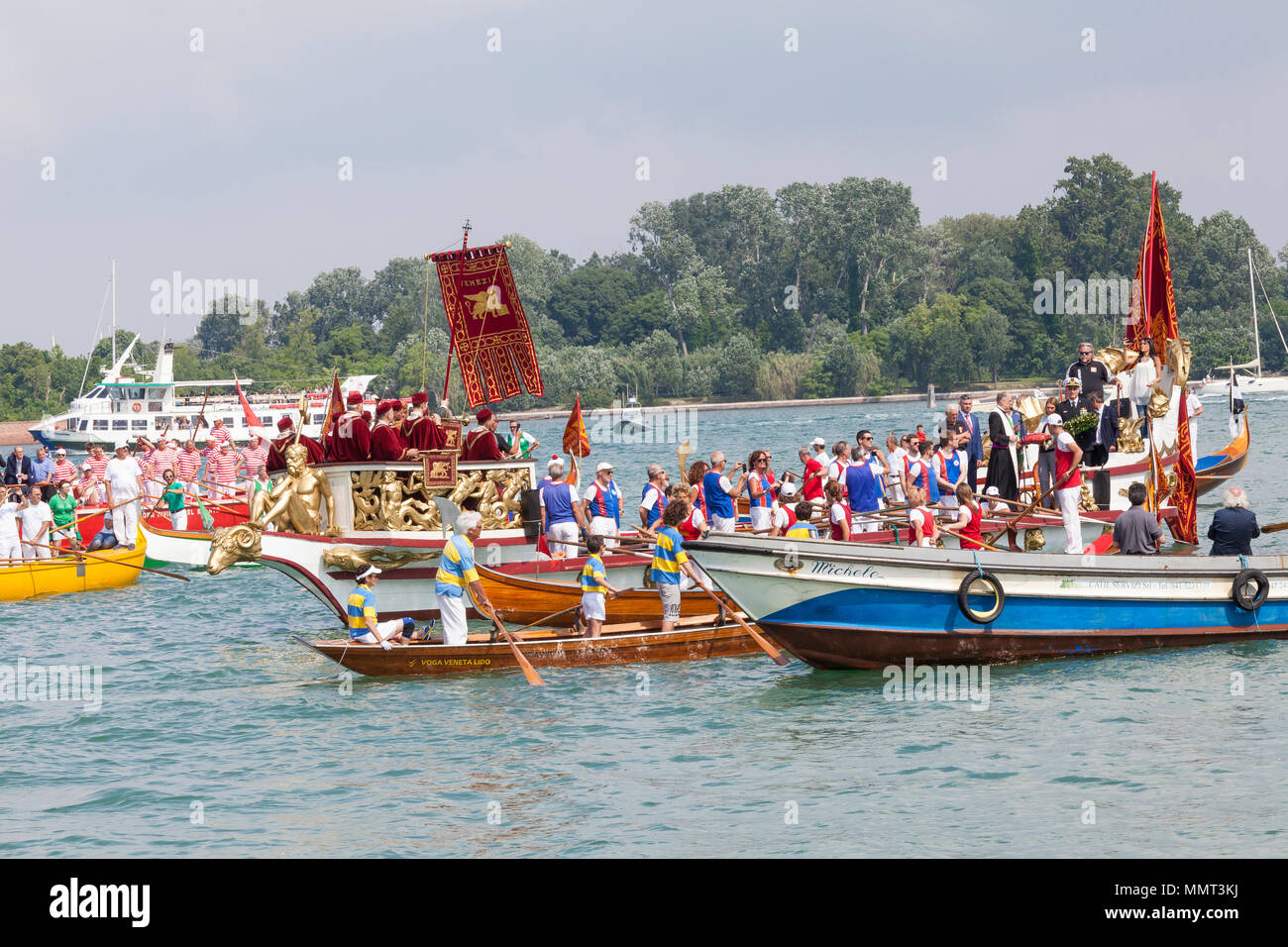 Venice, Veneto, Italy.  13th May 2018.  The cortege or corteo  of rowers in the boats accompanying the Serenissama ceremonial boat during Festa de la Sensa with the dignatories Mayor Brugnaro, the Head of the Navy  and Patriarch of Venice,  at Lido during the ceremony for the blessing of the gold ring by the Patriach  which is then tossed into the lagoon marrying Venice to the sea. Credit Mary Clarke/Alamy Live News Stock Photo