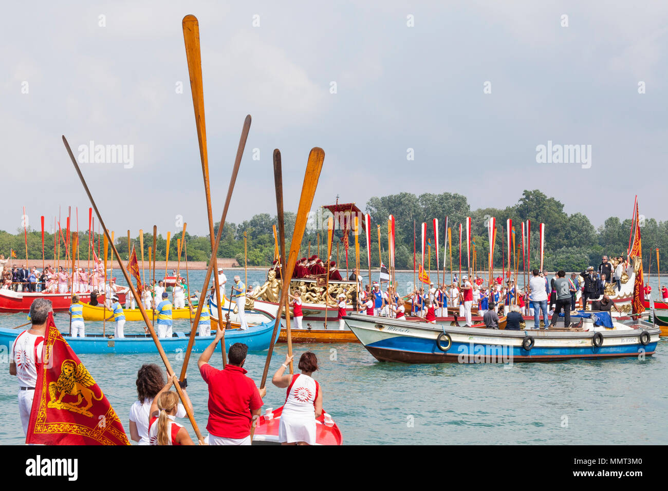 Venice, Veneto, Italy.  13th May 2018.  The cortege or corteo  of rowers in the boats accompanying the Serenissama ceremonial boat during Festa de la Sensa with the dignitaries Mayor Brugnaro, the Head of the Navy and Patriacrh of Venice,  at Lido during the ceremony for the blessing of the gold ring by the Patriach  which is then tossed into the lagoon marrying Venice to the sea. Credit Alamy Live News Stock Photo