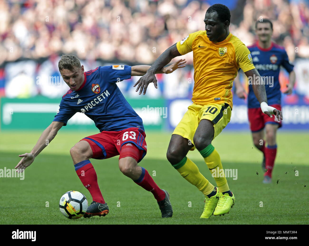 Moscow, Russia. 13th May, 2018. MOSCOW, RUSSIA - MAY 13, 2018: CSKA  Moscow's Fyodor Chalov and Anzhi Makhachkala's Kwadwo Poku (L-R front) in  their 2017/2018 Russian Football Premier League Round 30 match