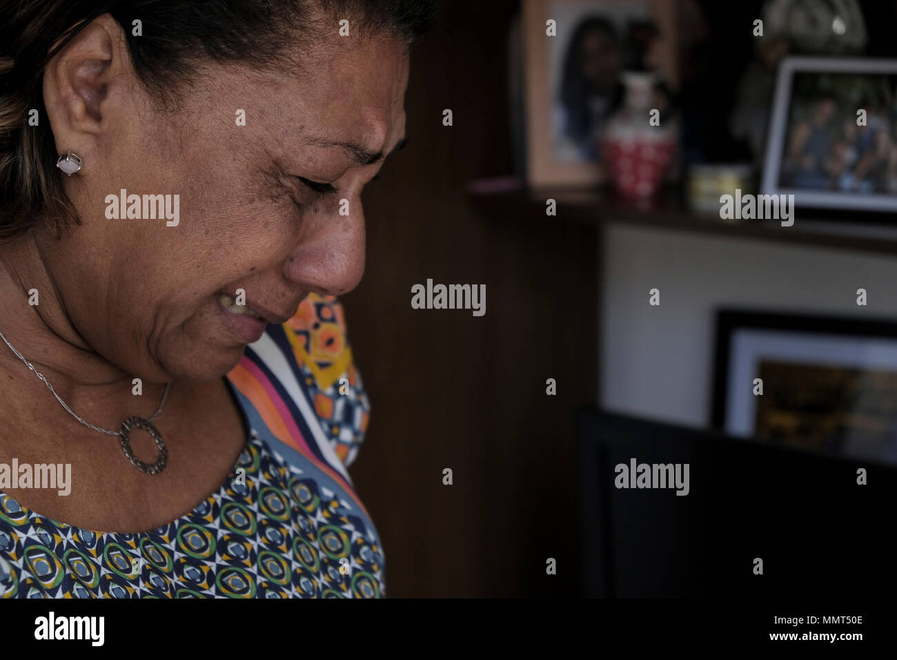 10 May 2018, Brazil, Rio de Janeiro: Marinete da Silva is touched as she talks in her apartment about her daughter, the murdered politician and critic of police brutality Marielle Franco. 'The murderers should receive mercy. Hate was never preached here', says Marinete, who will spend Mother's Day without her daughter on May 13th. The politician, who came from a slum in Rio, was one of the country's most prominent human rights activists and was a member of the city parliament for the leftist party Socialism and Freedom (PSOL). She was shot dead by unknown persons in the center of Rio. The 38-y Stock Photo