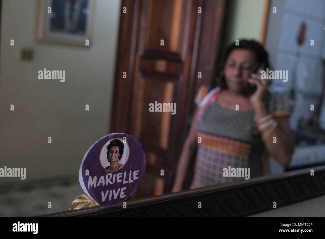 10 May 2018, Brazil, Rio de Janeiro: A sticker with the photo of the murdered politician and critic of the police brutality Marielle Franco. 'The murderers should receive mercy. Hate was never preached here', says Marinete, who will spend Mother's Day without her daughter on May 13th. The politician, who came from a slum in Rio, was one of the country's most prominent human rights activists and was a member of the city parliament for the leftist party Socialism and Freedom (PSOL). She was shot dead by unknown persons in the center of Rio. The 38-year-old had accused the police of several murde Stock Photo