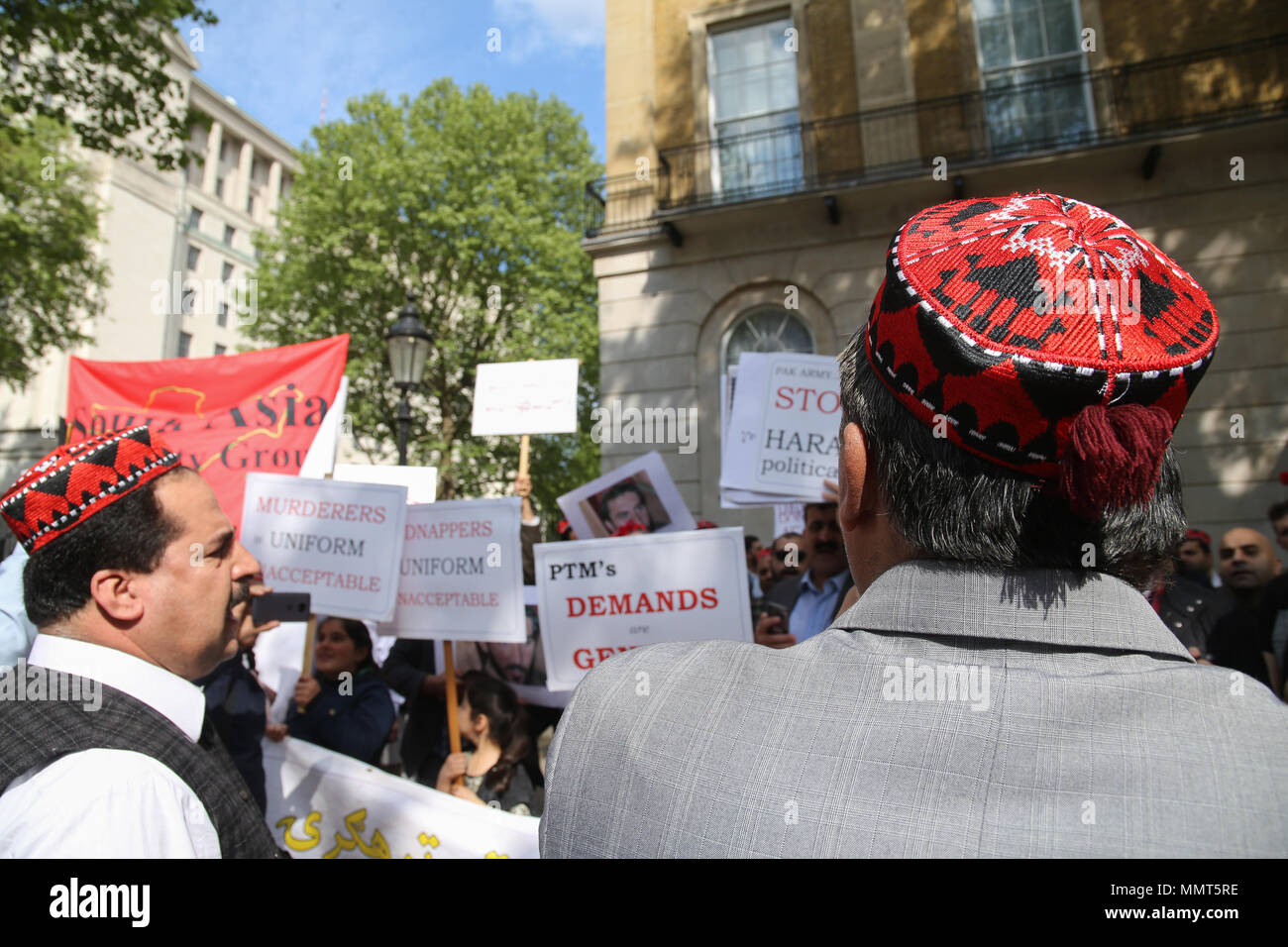 London UK 13 May 2018 Pakistanis Pashtuns wearing their traditional Pakol,soft round-topped hat,protesting outside Downing Street asking the British Government to help them to stop the disappearance and torture by the Pakistani army of their people. Pashtuns are predominantly an Eastern Iranian people, who use Pashto as their first language, and live in Pakistan and Afghanistan.@Paul Quezada-Neiman/Alamy Live News Stock Photo