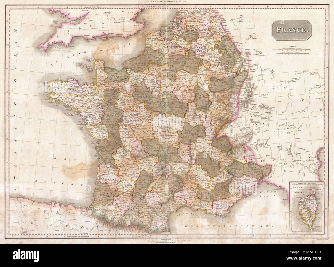 .  English: Pinkerton's extraordinary 1818 map of France. Covers the entire country from the Bay of Biscay to the English Channel to the Mediterranean, to the borders with Switzerland and Germany. Drawn shortly after the Napoleonic Wars. Divided according to departments. An inset of Corsica appears in the lower right quadrant. Offers considerable detail with political divisions and color coding at the regional level. Identifies cities, towns, castles, important battle sites, castles, swamps, mountains and river ways. Title plate in the upper right quadrant. Two mile scales, in French Leagues a Stock Photo