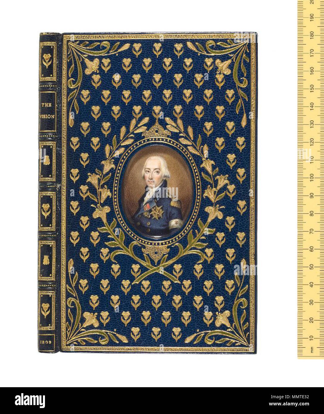 . Cosway-style binding. English (London), c.1930. Rivière & Son. Blue goatskin, the front cover decorated with gilt tulips and contrasting onlay flowers, lily cornerpieces, and wreath surrounding miniature painting of the Duc d'Enghien under glass; back cover with bees semée (scattered) around miniature of Napoleon. These bindings were devised by the London bookseller Henry Sotheran, inspired by the 18thcentury miniaturist Richard Cosway (1740–1821). They became hugely popular in the first half of the 20th century, with the miniaturepainter Miss C. B. Currie responsible for almost a thousand b Stock Photo