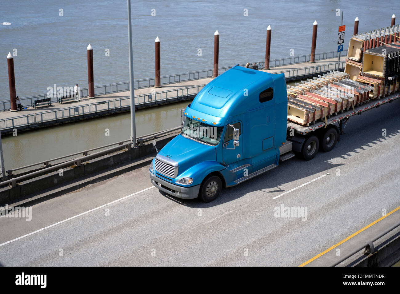 Big Rig Long Haul Blue Semi Truck With Tall Cab And Flat Bed Semi