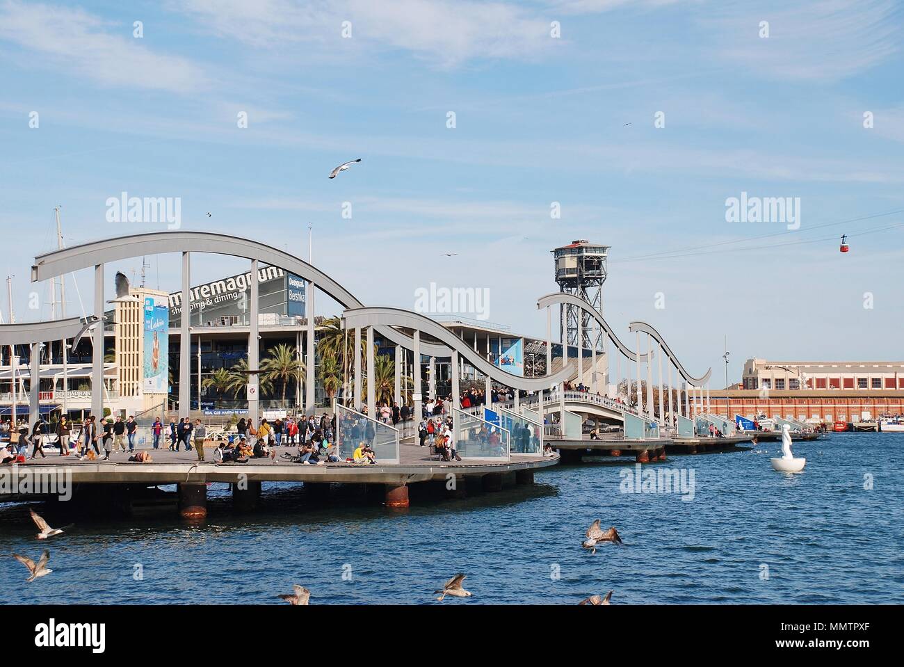 The Rambla del Mar floating footbridge at Port Vell in Barcelona, Spain on April 15, 2018. The bridge was opened in 1994. Stock Photo