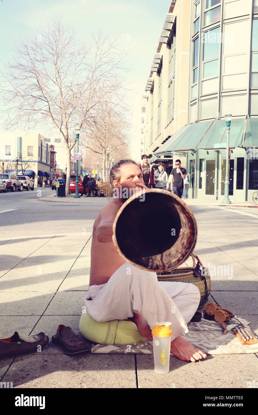 Santa Cruz, California, January 15, 2012: Street didgeridoo performer playing at his instrument Stock Photo