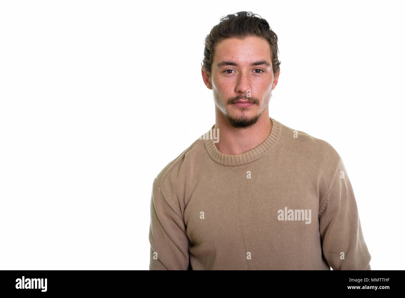 Studio shot of young handsome man isolated against white backgro Stock Photo