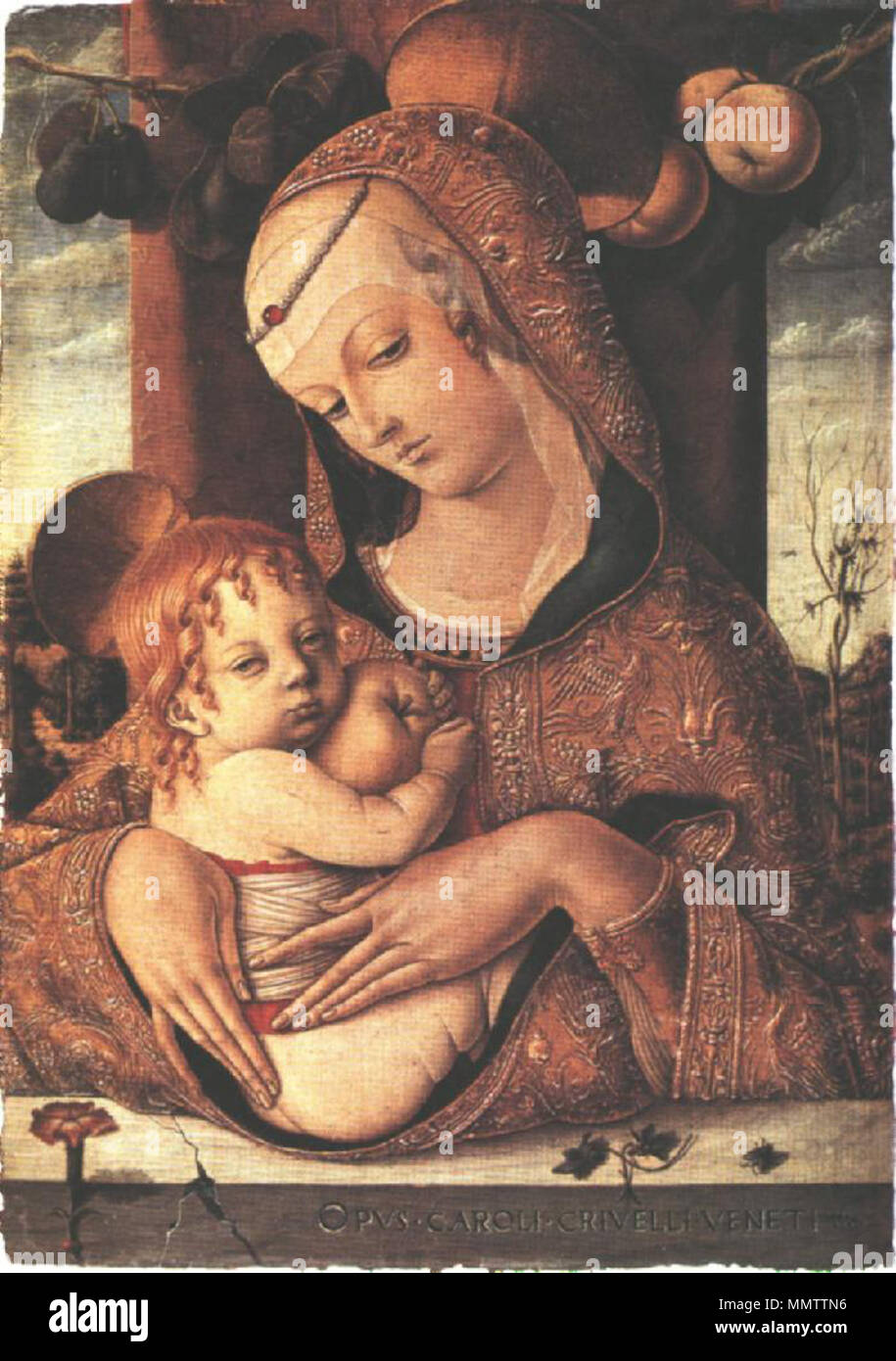 .  English: This is a small devotional image. Reminding Mantegna's paintings there are peaches and figs above Mary. Their Christian symbolical meanings relate to the story of Christ: Redemption (peach) and Fertility (fig). On the parapet are the pink or carnation, symbol of the Passion of Christ while violets are Marian flowers enhancing the Virgin's humility and purity. The fly on the parapet far right, represents evil, justifying the sacrifice of Christ.  Madonna and Child. circa 1480. Carlo Crivelli - Virgin and Child - WGA5799 Stock Photo