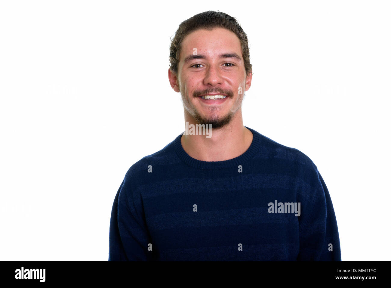 Young happy man smiling isolated against white backg Stock Photo
