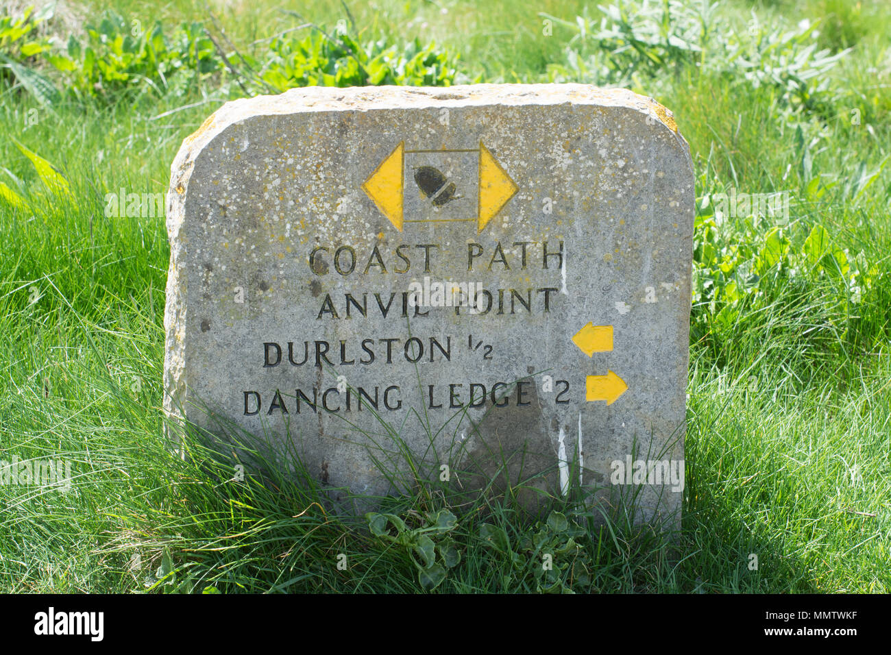 Milestone on the Jurassic coast path at Anvil Point in the Durlston Country Park, Dorset, UK Stock Photo