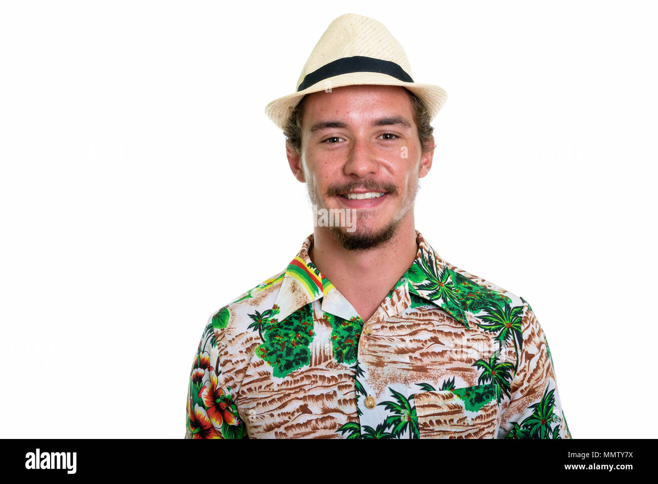Close up of young happy tourist man smiling isolated against whi Stock Photo