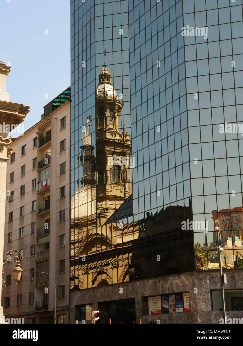 Metropolitan Cathedral reflected in the glass of a modern office tower, Santiago, Chile Stock Photo