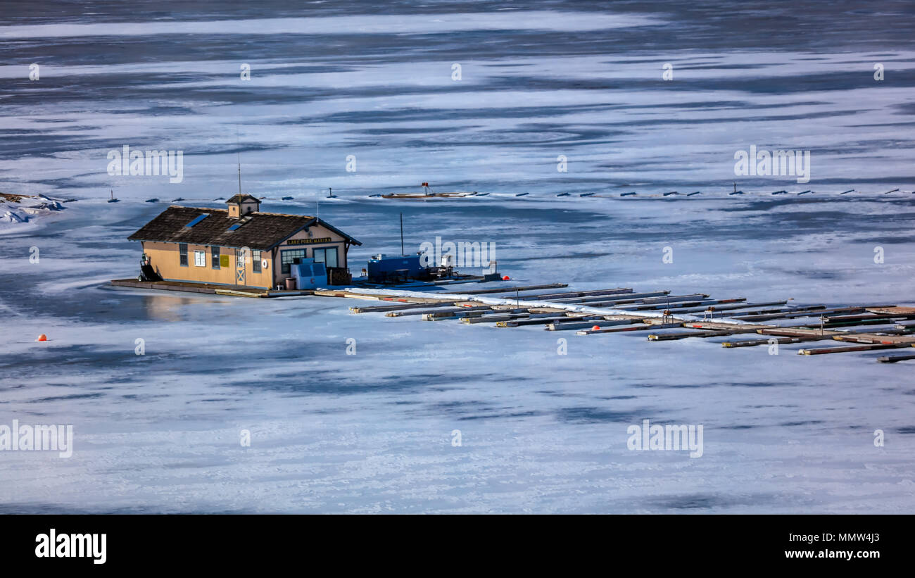 FROZEN LAKE - COLORADO, MARCH 8, 2017 - Lake Fork Marina boat docks on Blue Mesa Reservoire, Sapinero Curecanti National Recreation Area, Highway off highway 50 between Gunnison and Montrose Colorado Stock Photo