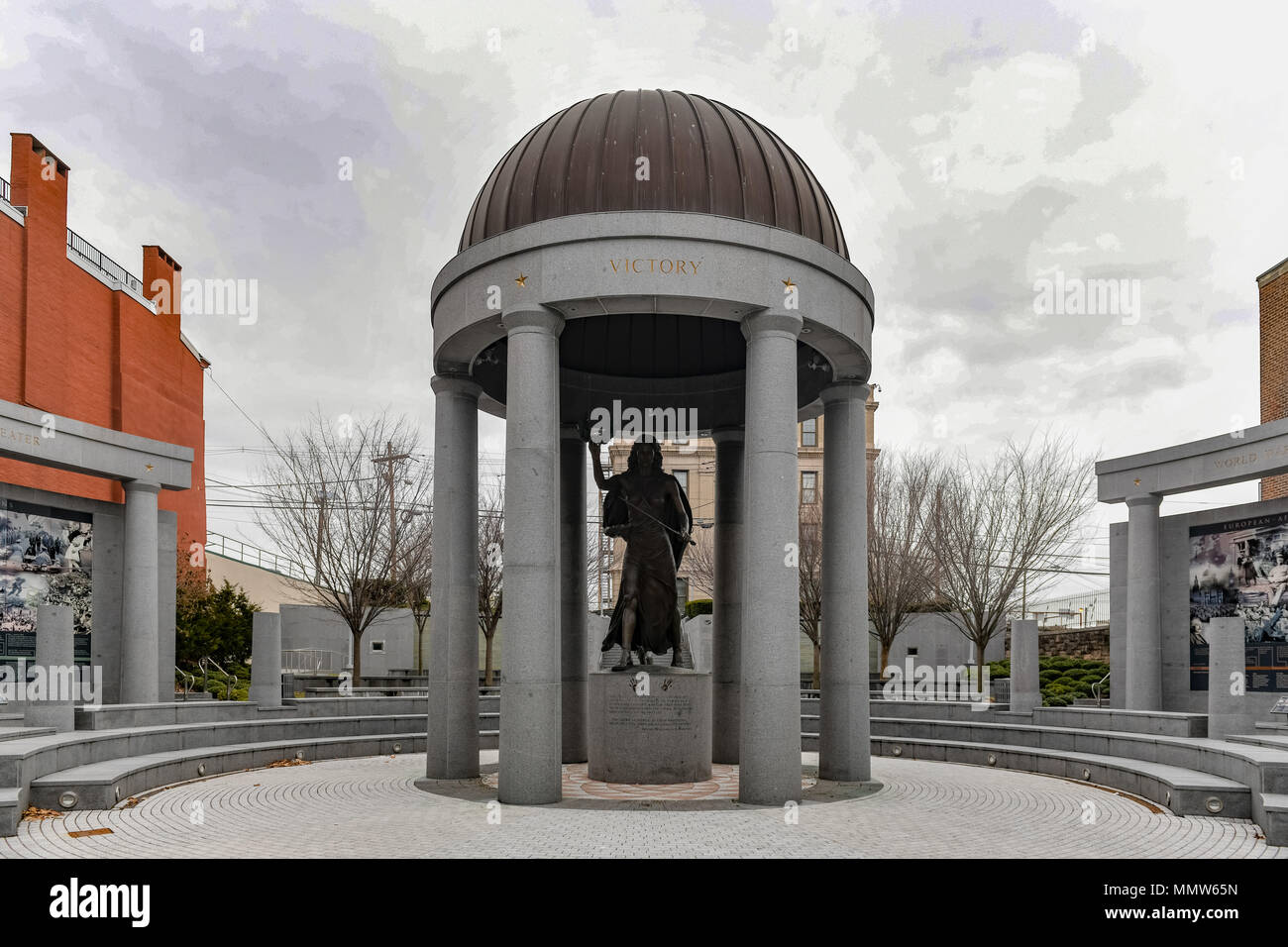 The bronze Lady Victory sculpture featuring a sword and wreath of peace in her hands stands under the NJ World War II Memorial rotunda in Trenton acro Stock Photo