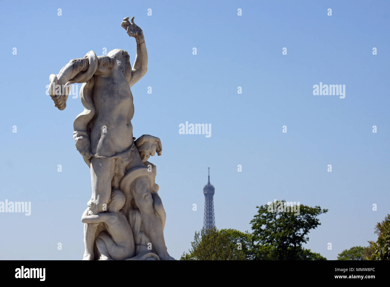 Marble statue with scared gesture and Eiffel tower in the back Stock