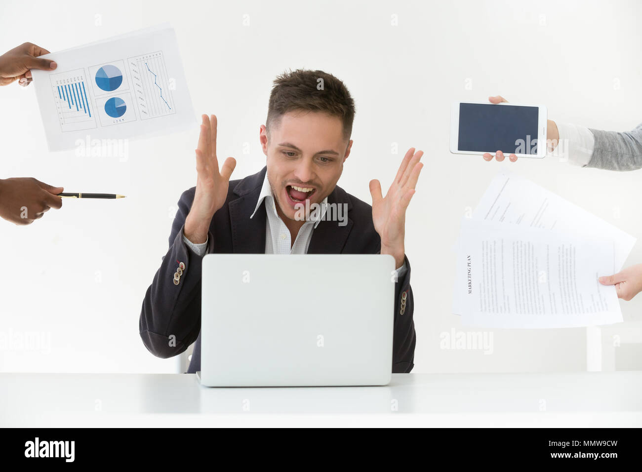 Annoyed overwhelmed businessman screaming feeling stressed, hate Stock Photo