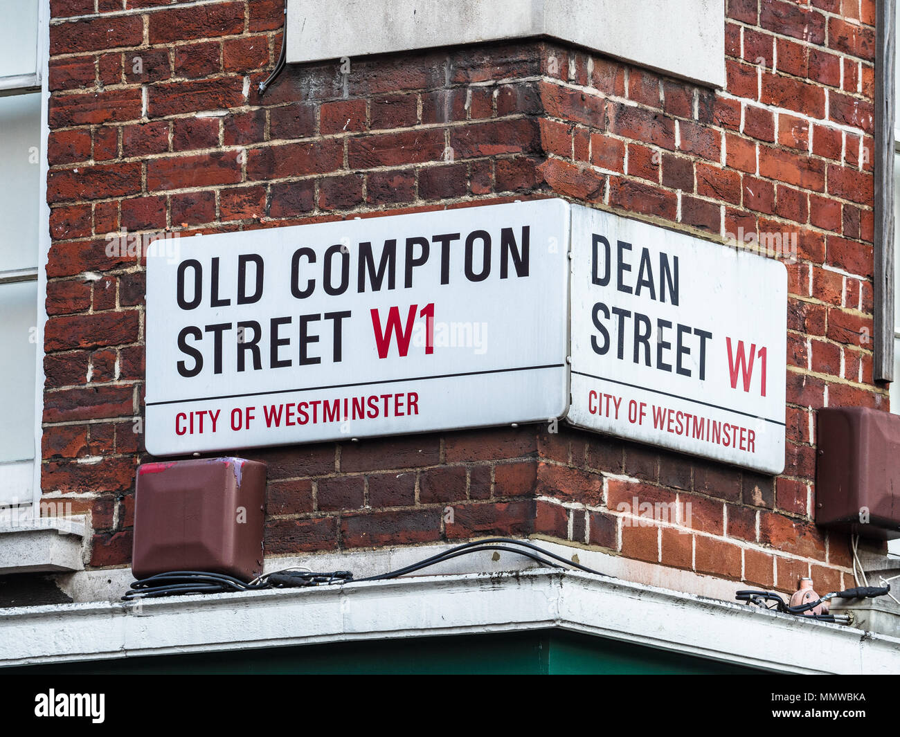 Soho Street Signs Series - Old Compton Street / Old Compton St & Dean Street / Dean St - London's Soho district Street Signs Stock Photo