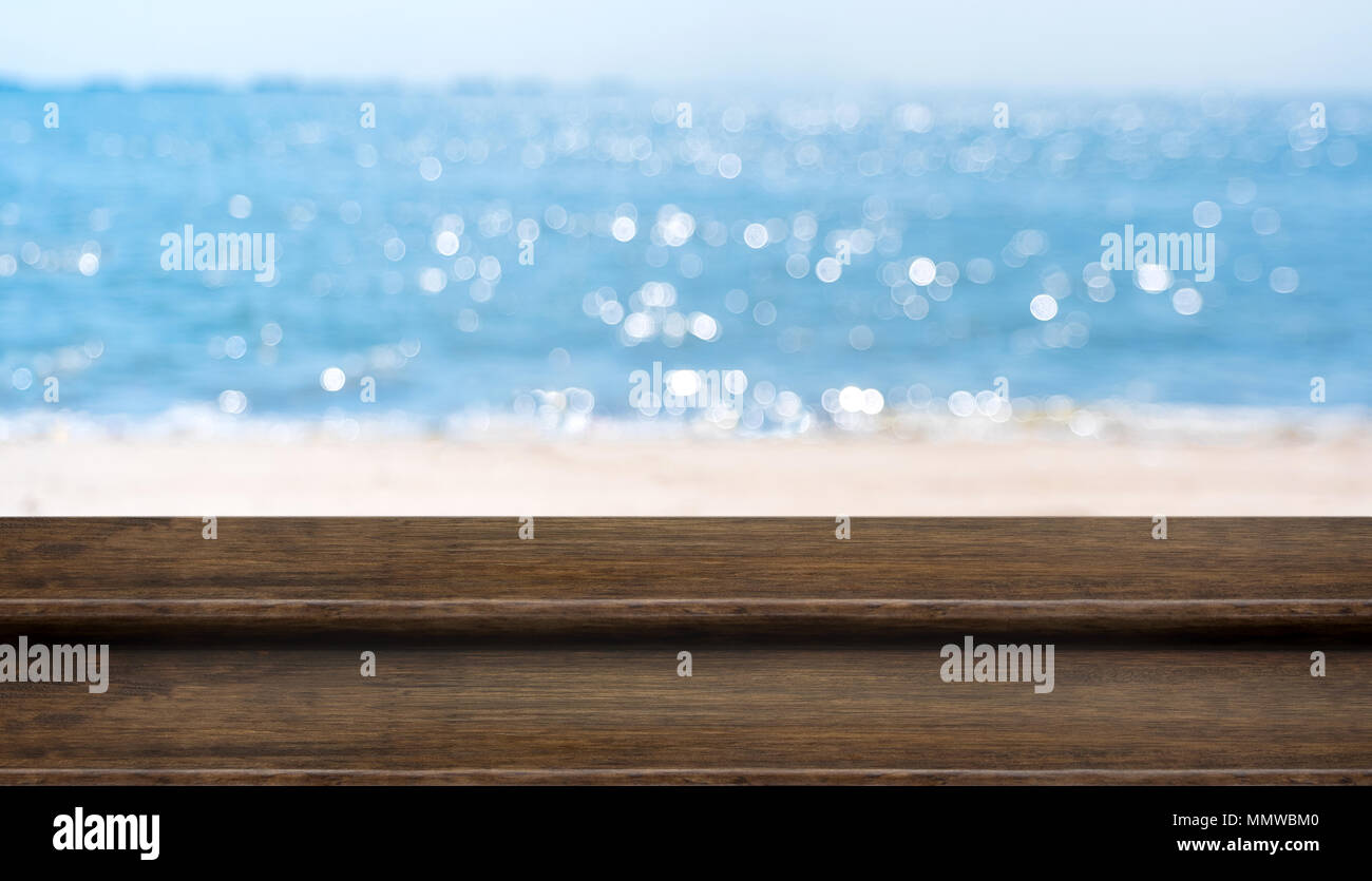 Empty Plank Wood Table Top With Blur Blue Sky And Sea Boekh