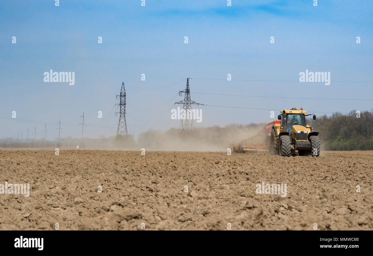Young Farmer Sowing Crops At Field With Pneumatic Sowing Machine Stock  Photo, Picture and Royalty Free Image. Image 51838995.