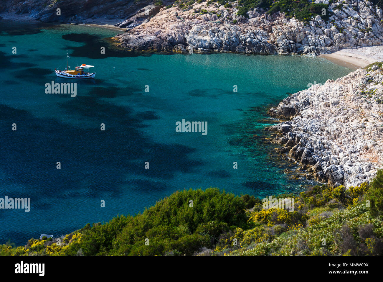 Traditional fishing boat at the beach near Agios Ioannis Thermastis village  on Fourni island in Greece Stock Photo - Alamy