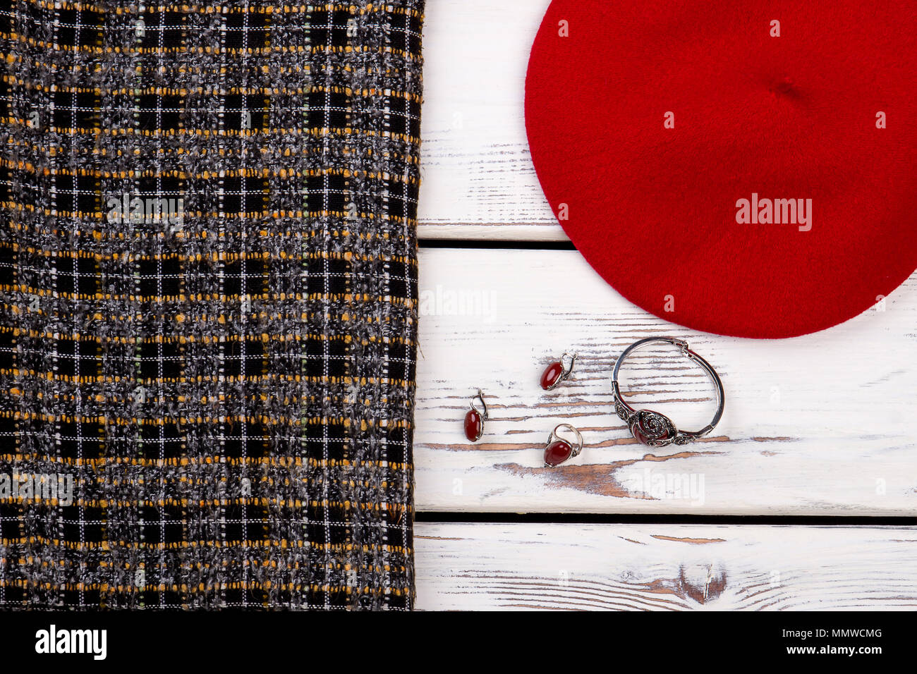 Female beret, skirt and jewelry. Stock Photo