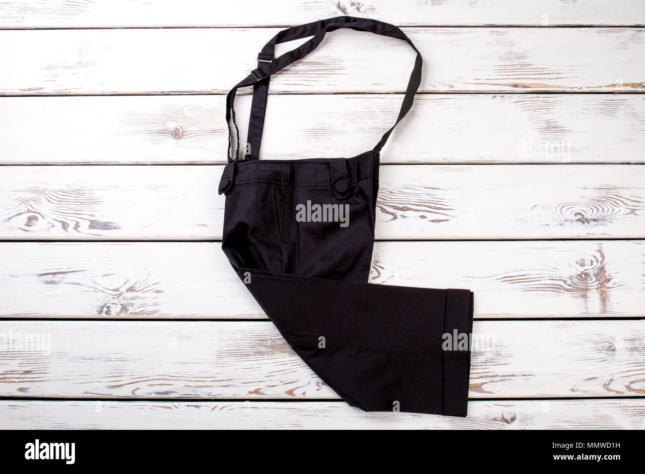 Black trousers with suspenders. Stock Photo