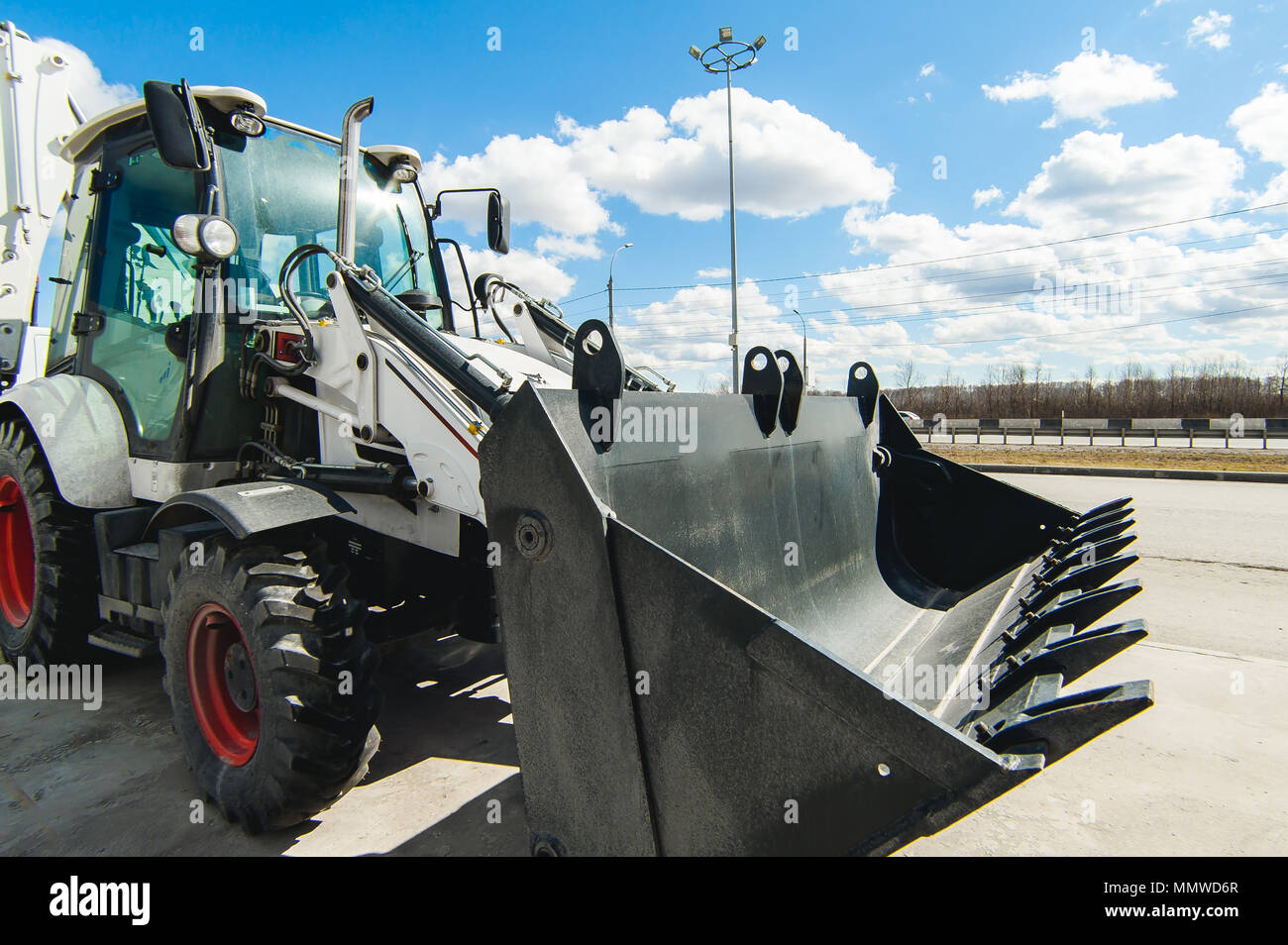 Excavator Loader Machine. Side View of Front Hoe Loader. Industrial