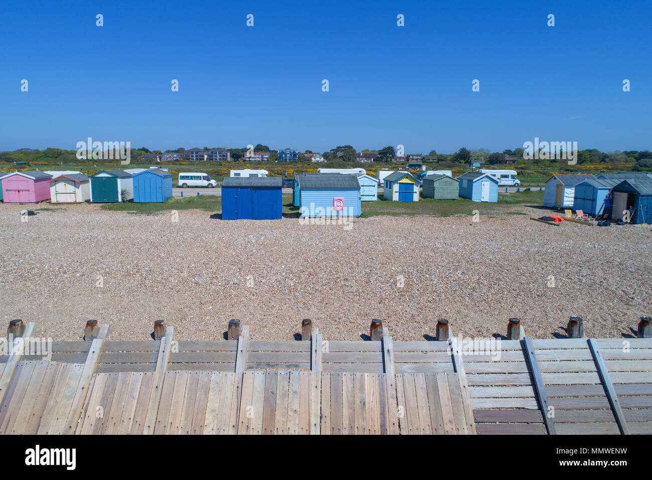 aerial views along the coast of hayling island and the beach huts in hampshire by drone Stock Photo