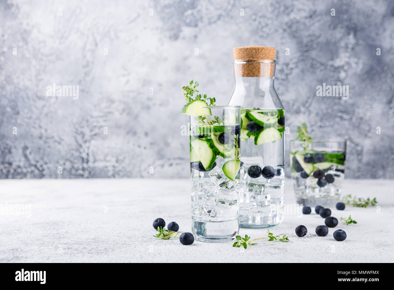 Detox infused flavored water with blueberry, cucumber and thyme on
